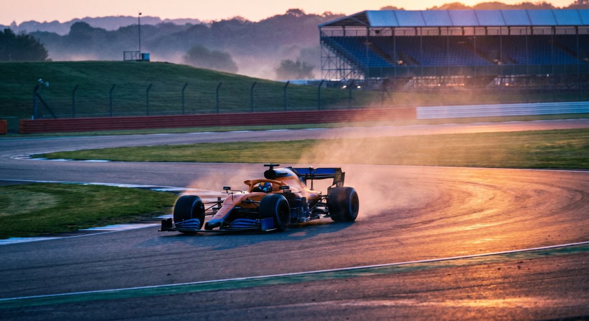 F1 racing car on UK track representing driver safety preparation